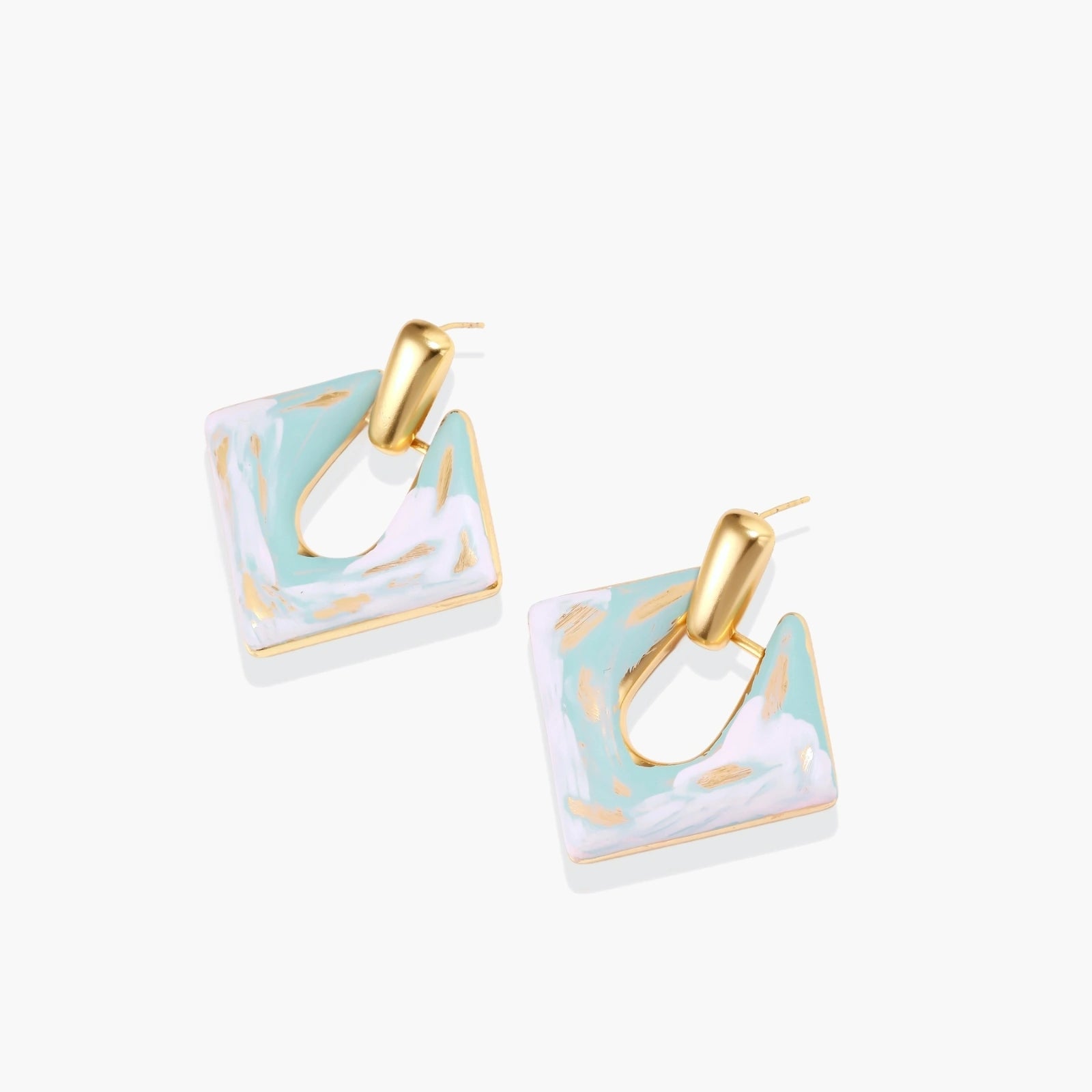 Geometric square enamel earrings with marbled turquoise and lavender pattern, gold U-shaped connector on cream background.