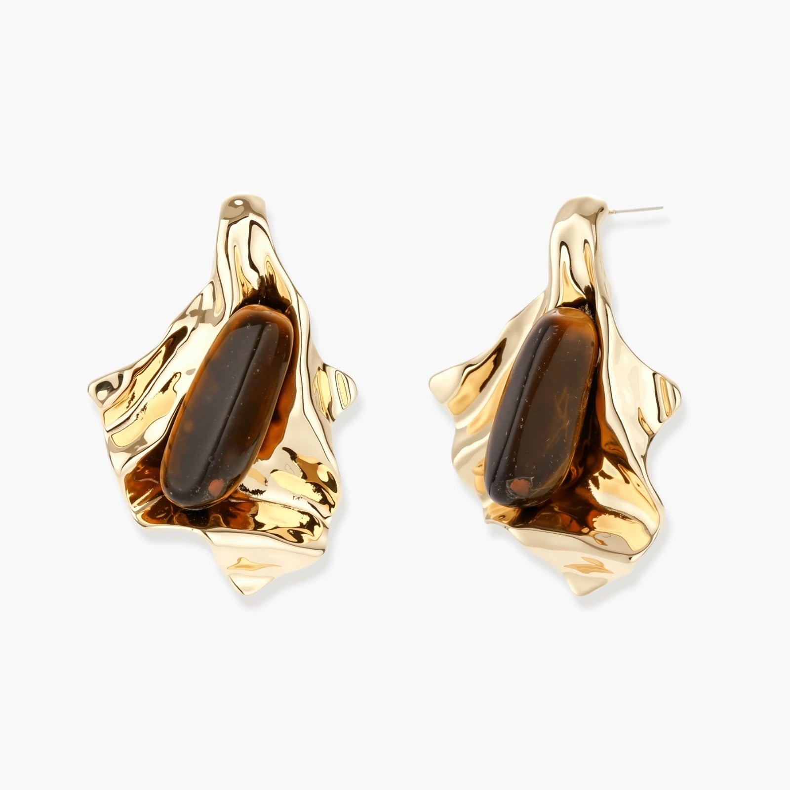 Sculptural stud earrings with organic twisted metal design holding brown gemstones, shown in gold and silver finishes.