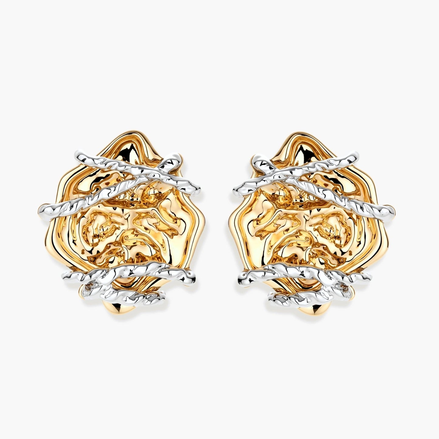 Sculptural rose-shaped stud earrings in gold with silver wire details and S925 posts on cream background.