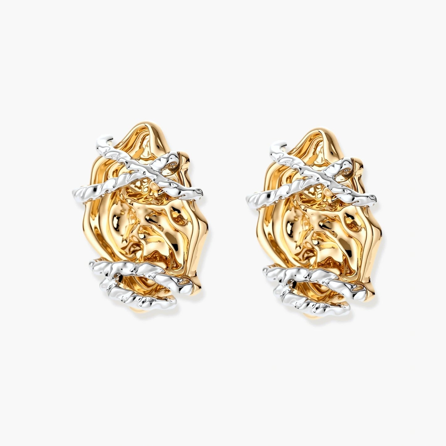 Sculptural rose-shaped stud earrings in gold with silver wire details and S925 posts on cream background.