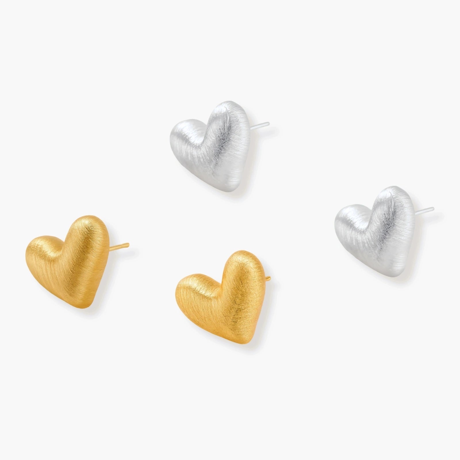 Pair of brushed platinum-plated 925 sterling silver puffy heart stud earrings on a cream background.
