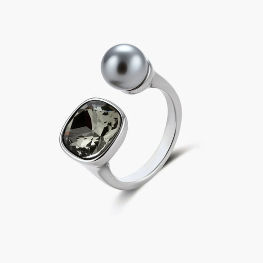 Modern adjustable ring with smoky zircon stone and metallic sphere in platinum-plated copper finish on neutral background.
